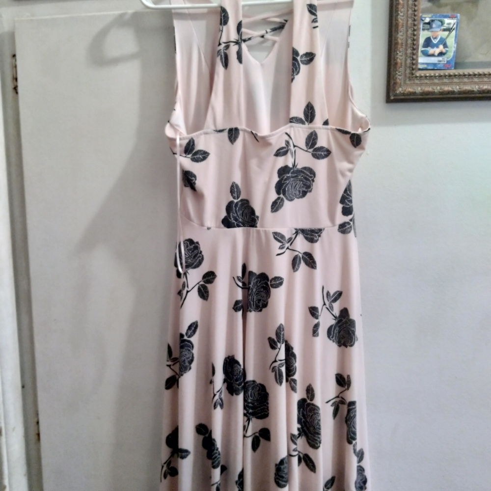 Large pink long dress with flowers.